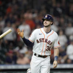 
              Houston Astros' Kyle Tucker (30) flips his bat after hitting a three-run home run against the Philadelphia Phillies during the first inning of a baseball game Tuesday, Oct. 4, 2022, in Houston. (AP Photo/David J. Phillip)
            