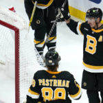 
              Boston Bruins left wing Brad Marchand (63) celebrates after his goal against Detroit Red Wings goaltender Ville Husso during the third period of an NHL hockey game, Thursday, Oct. 27, 2022, in Boston. (AP Photo/Charles Krupa)
            