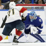 
              Tampa Bay Lightning goaltender Andrei Vasilevskiy (88) makes a save on a shot by Florida Panthers center Chris Tierney (71) during the second period of an NHL preseason hockey game Saturday, Oct. 8, 2022, in Tampa, Fla. (AP Photo/Chris O'Meara)
            
