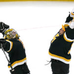
              Boston Bruins goaltender Jeremy Swayman, left, celebrates with Linus Ullmark after defeating the Detroit Red Wings 5-1, following an NHL hockey game, Thursday, Oct. 27, 2022, in Boston. (AP Photo/Charles Krupa)
            