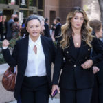 
              Alana Gee, left, the widow of a former University of Southern California football player suing the NCAA for failing to protect her husband from repetitive head trauma, and her daughter, Malia, center, leave the Stanley Mosk civil courthouse of Los Angeles Superior Court on Friday, Oct. 21, 2022. Matthew Gee died in 2018 from permanent brain damage caused by countless blows to the head he took while playing linebacker for the 1990 Rose Bowl winning team, according to the wrongful death suit filed by Alana Gee. (AP Photo/Ringo H.W. Chiu)
            