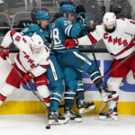 
              Carolina Hurricanes left wing Teuvo Teravainen (86) and defenseman Brent Burns (8) collide with San Jose Sharks center Tomas Hertl (48) and right wing Timo Meier (28) during the third period of an NHL hockey game in San Jose, Calif., Friday, Oct. 14, 2022. (AP Photo/Godofredo A. Vásquez)
            