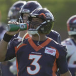 
              Denver Broncos quarterback Russell Wilson drinks during a practice session in Harrow, England, Wednesday, Oct. 26, 2022 ahead the NFL game against Jacksonville Jaguars at the Wembley stadium on Sunday. (AP Photo/Kin Cheung)
            