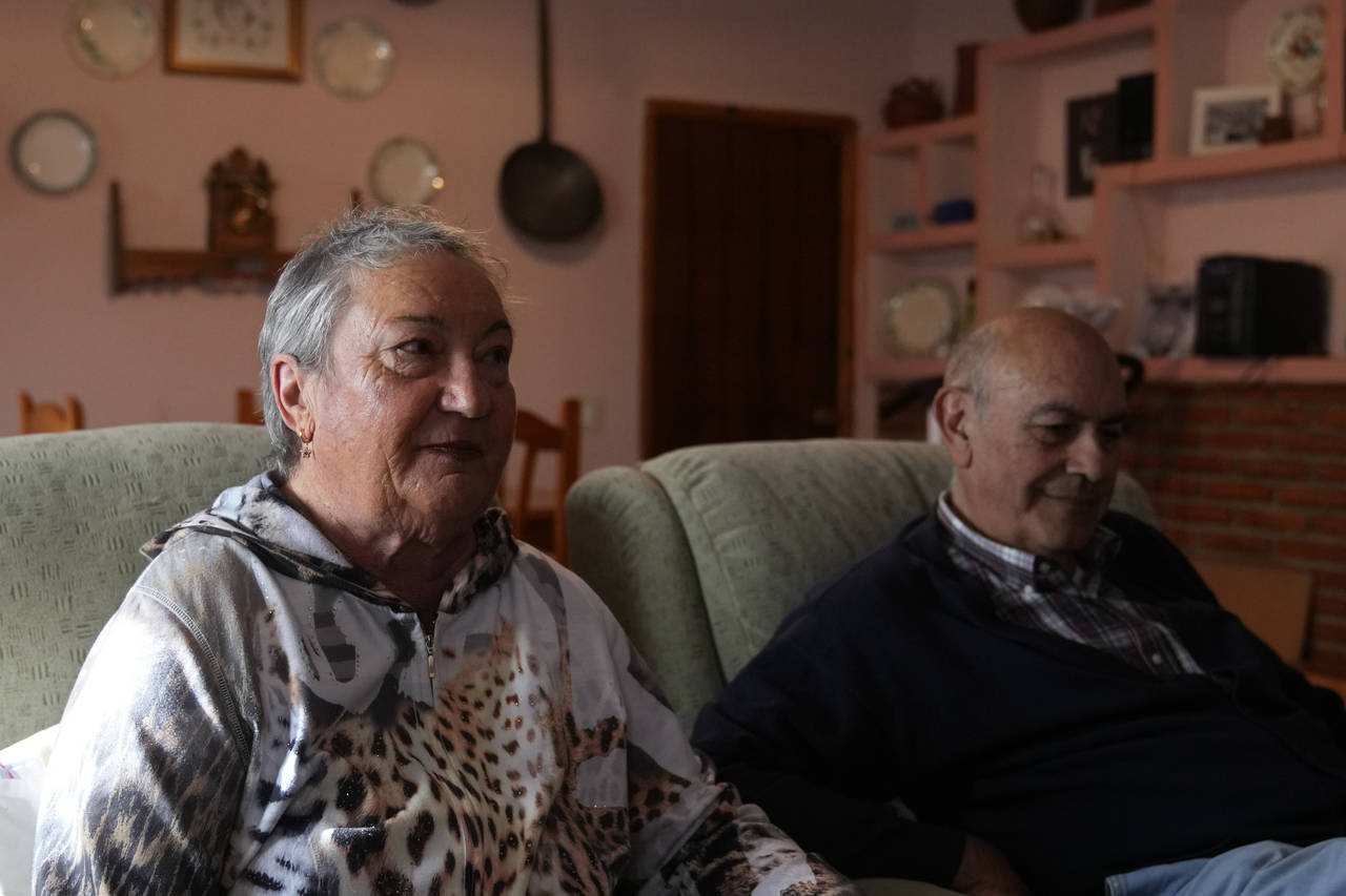 The parents of Santiago Sanchez Cogedor, Celia Cogedor, left and Santiago Sanchez speak during an i...