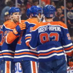 
              Edmonton Oilers' Connor McDavid (97), Evander Kane (91) and Ryan Nugent-Hopkins (93) celebrate a goal against the Calgary Flames during the second period of an NHL hockey game Saturday, Oct. 15, 2022, in Edmonton, Alberta. (Jason Franson/The Canadian Press via AP)
            