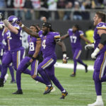 
              Minnesota Vikings players celebrate after winning an NFL match against New Orleans Saints at the Tottenham Hotspur stadium in London, Sunday, Oct. 2, 2022. The Vikings won the match 28-25. (AP Photo/Frank Augstein)
            