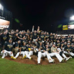 
              The San Diego Padres pose for a picture after defeating the Los Angeles Dodgers 5-3 in Game 4 of a baseball NL Division Series, Saturday, Oct. 15, 2022, in San Diego. (AP Photo/Ashley Landis)
            