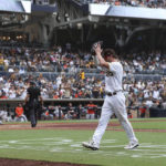
              San Diego Padres' Wil Myers, foreground, claps his hands after being removed in the eighth inning of a baseball game against the San Francisco Giants, Wednesday, Oct. 5, 2022, in San Diego. (AP Photo/Derrick Tuskan)
            
