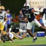 
              Auburn running back Jarquez Hunter (27) runs past LSU safety Todd Harris Jr. (4) after a catch in the first half of an NCAA college football game, Saturday, Oct. 1, 2022, in Auburn, Ala. (AP Photo/John Bazemore)
            