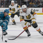 
              San Jose Sharks center Nico Sturm (7) and Vegas Golden Knights center Michael Amadio (22) chase after the puck during the second period of an NHL hockey game in San Jose, Calif., Tuesday, Oct. 25, 2022. (AP Photo/Godofredo A. Vásquez)
            