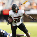 
              Louisville's Jawhar Jordan runs toward the end zone while a flag is throw during an NCAA college football game against Virginia in Charlottesville, Va., Saturday, Oct. 8, 2022. (Mike Kropf/The Daily Progress via AP)
            