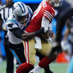 
              San Francisco 49ers quarterback Jimmy Garoppolo is tackled by Carolina Panthers defensive end Brian Burns during the first half an NFL football game on Sunday, Oct. 9, 2022, in Charlotte, N.C. (AP Photo/Rusty Jones)
            