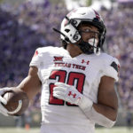 
              Texas Tech wide receiver Nehemiah Martinez I scores a touchdown during the first half of an NCAA college football game against Kansas State Saturday, Oct. 1, 2022, in Manhattan, Kan. (AP Photo/Charlie Riedel)
            