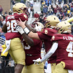 
              Boston College running back Alex Broome celebrates his touchdown during the first half of an NCAA college football game against Louisville, Saturday, Oct. 1, 2022, in Boston. (AP Photo/Mark Stockwell)
            