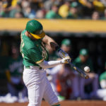 
              Oakland Athletics' Chad Pinder hits a double against the Los Angeles Angels during the fifth inning of a baseball game in Oakland, Calif., Wednesday, Oct. 5, 2022. (AP Photo/Godofredo A. Vásquez)
            