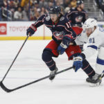
              Columbus Blue Jackets' Johnny Gaudreau, left, and Tampa Bay Lightning's Erik Cernak chase the puck during the second period of an NHL hockey game Friday, Oct. 14, 2022, in Columbus, Ohio. (AP Photo/Jay LaPrete)
            