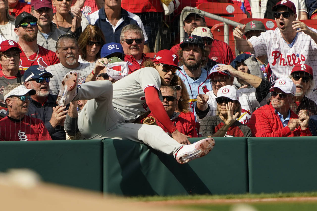 Philadelphia Phillies third baseman Alec Bohm makes a catch on a ball hit by St. Louis Cardinals' L...