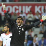 
              FILE - Iran's goalkeeper Alireza Safar Beiranvand reacts during a friendly soccer match between Turkey and Iran, in Istanbul, Monday, May 28, 2018. (AP Photo, File)
            