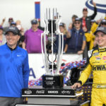 
              Christopher Bell, right, celebrates in Victory Lane after winning a NASCAR Cup Series auto race at Charlotte Motor Speedway, Sunday, Oct. 9, 2022, in Concord, N.C. (AP Photo/Matt Kelley)
            