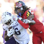 
              Northwestern wide receiver Malik Washington runs the ball after making a reception as Maryland defensive back Corey Coley Jr. tackles in the first half of an NCAA college football game, Saturday, Oct. 22, 2022, in College Park, Md. (AP Photo/Gail Burton)
            