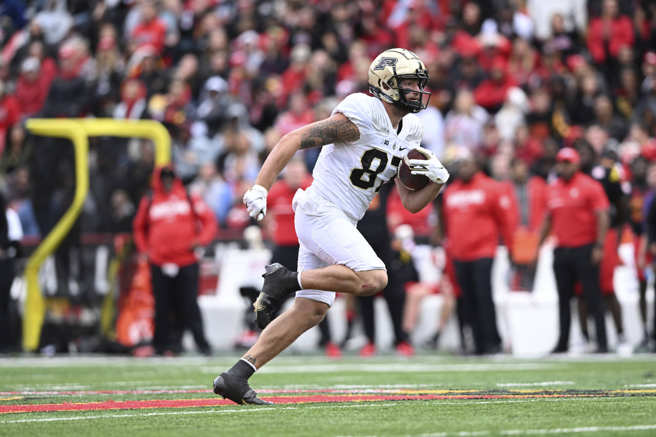 Purdue tight end Payne Durham rushes for a first down late in the second half of an NCAA college fo...