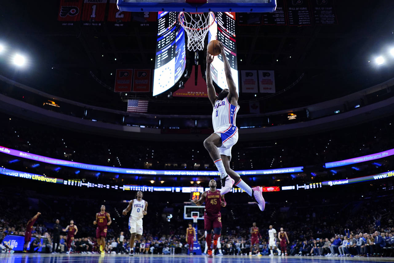Philadelphia 76ers' James Harden goes up for a dunk during the first half of a preseason NBA basket...