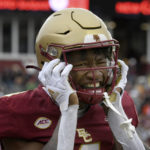
              Boston College wide receiver Zay Flowers reacts after a touchdown against Louisville during the first half of an NCAA college football game Saturday, Oct. 1, 2022, in Boston. (AP Photo/Mark Stockwell)
            