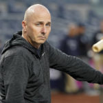 
              New York Yankees general manager Brian Cashman attends batting practice during a workout ahead of Game 1 of baseball's American League Division Series against the Cleveland Guardians, Monday, Oct. 10, 2022, in New York. (AP Photo/John Minchillo)
            