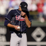 
              Atlanta Braves starting pitcher Charlie Morton (50) wipes his face during the second inning in Game 4 of baseball's National League Division Series between the Philadelphia Phillies and the Atlanta Braves, Saturday, Oct. 15, 2022, in Philadelphia. (AP Photo/Matt Slocum)
            