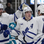 
              Toronto Maple Leafs right wing Mitchell Marner (16) celebrates with teammates after scoring against the San Jose Sharks during the second period of an NHL hockey game in San Jose, Calif., Thursday, Oct. 27, 2022. (AP Photo/Godofredo A. Vásquez)
            