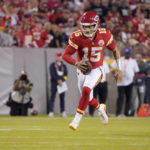
              Kansas City Chiefs quarterback Patrick Mahomes scrambles for a first down during the first half of an NFL football game against the Las Vegas Raiders Monday, Oct. 10, 2022, in Kansas City, Mo. (AP Photo/Ed Zurga)
            