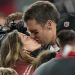 
              FILE - Tampa Bay Buccaneers quarterback Tom Brady kisses wife Gisele Bundchen after defeating the Kansas City Chiefs in the NFL Super Bowl 55 football game Sunday, Feb. 7, 2021, in Tampa, Fla. The Buccaneers defeated the Chiefs 31-9 to win the Super Bowl. The couple announced Friday they have finalized their divorce, ending their 13-year marriage. (AP Photo/David J. Phillip, File)
            