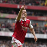 
              Arsenal's Granit Xhaka celebrates after scoring his side's third goal during the English Premier League soccer match between Arsenal and Tottenham Hotspur, at Emirates Stadium, in London, England, Saturday, Oct. 1, 2022. (AP Photo/Kirsty Wigglesworth)
            