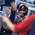 
              Atlanta Braves' William Contreras is congratulated by teammates after he scored on a single by Eddie Rosario during the fourth inning of a baseball game against the Miami Marlins, Wednesday, Oct. 5, 2022, in Miami. (AP Photo/Wilfredo Lee)
            