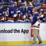 
              Former New York Islander Ed Westfall high-fives players after dropping a ceremonial first puck before the team's NHL hockey game against the Florida Panthers on Thursday, Oct. 13, 2022, in Elmont, N.Y. (AP Photo/Adam Hunger)
            
