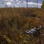 
              The body of a local man who was killed after an explosion of a Russian mine lies on the ground near Hrakove village, Ukraine, Thursday, Oct. 13, 2022. (AP Photo/Francisco Seco)
            