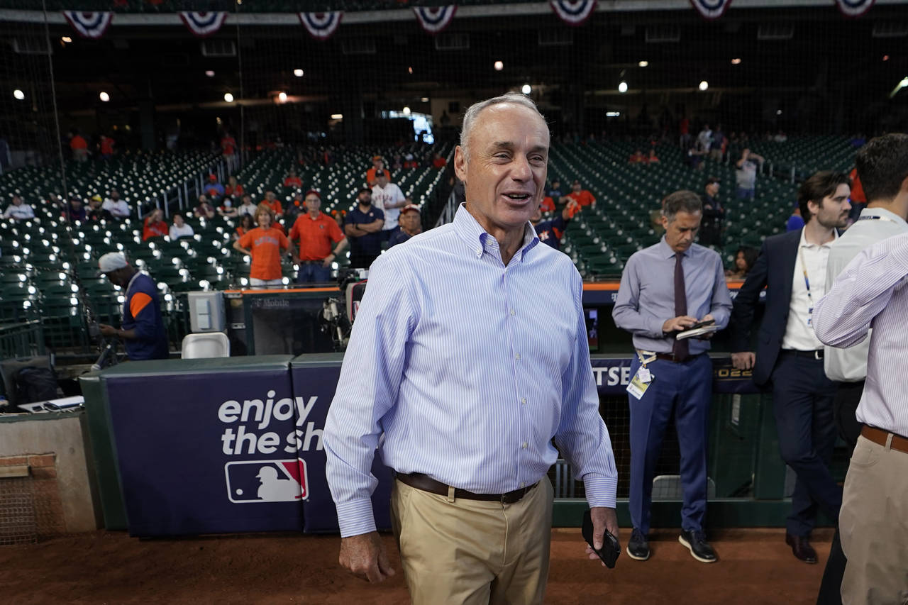 Major League Baseball Commissioner Rob Manfred walks on the field before Game 2 of an American Leag...