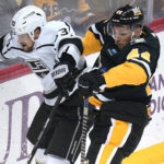 
              Pittsburgh Penguins' Jan Rutta (44) and Los Angeles Kings' Viktor Arvidsson (33) collide during the first period of an NHL hockey game in Pittsburgh, Thursday, Oct. 20, 2022. (AP Photo/Gene J. Puskar)
            