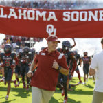
              Oklahoma head coach Brent Venables leads his team onto the field before an NCAA college football game against Kansas on Saturday, Oct. 15, 2022, in Norman, Okla. (AP Photo/Alonzo Adams)
            
