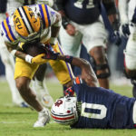 
              LSU safety Greg Brooks Jr. (3) intercepts a pass intended for Auburn wide receiver Koy Moore (0) in the second half of an NCAA college football game Saturday, Oct. 1, 2022, in Auburn, Ala. (AP Photo/John Bazemore)
            