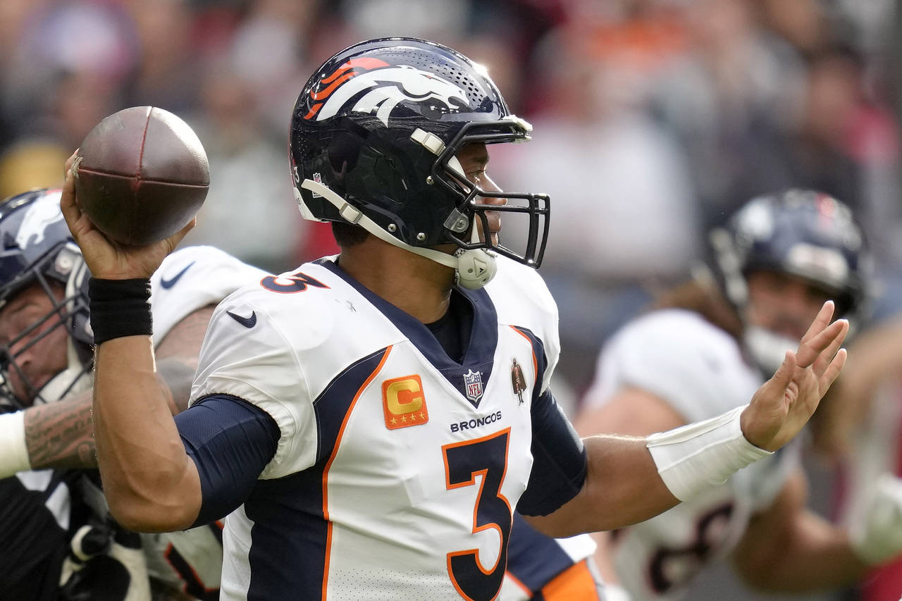 Denver Broncos quarterback Russell Wilson (3) throws the ball during the NFL football game between ...