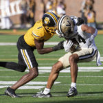 
              Vanderbilt's Will Sheppard, right, is tackled by Missouri defensive back Jaylon Carlies, left, during the second quarter of an NCAA college football game Saturday, Oct. 22, 2022, in Columbia, Mo. (AP Photo/L.G. Patterson)
            