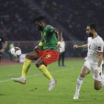 
              FILE - Cameroon's Andre-Frank Zambo Anguissa, left, challenges for the ball with Egypt's Amr El Solia during the African Cup of Nations 2022 semi-final soccer match between Cameroon and Egypt at the Olembe stadium in Yaounde, Cameroon, Thursday, Feb. 3, 2022. (AP Photo/Sunday Alamba, File)
            