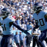 
              Tennessee Titans linebacker David Long Jr. (51) celebrates after intercepting a pass as teammate Lonnie Johnson (20) watches during the first half of an NFL football game against the Indianapolis Colts Sunday, Oct. 23, 2022, in Nashville, Tenn. (AP Photo/Mark Humphrey)
            