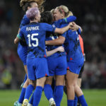 
              United States' Sophia Smith celebrates with teammates after scoring her side's opening goal during the women's friendly soccer match between England and the US at Wembley stadium in London, Friday, Oct. 7, 2022. (AP Photo/Kirsty Wigglesworth)
            