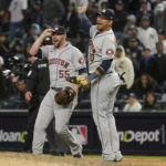 
              Houston Astros relief pitcher Ryan Pressly (55) and first baseman Yuli Gurriel (10) celebrate after beating the New York Yankees in Game 4 of an American League Championship baseball series, Monday, Oct. 24, 2022, in New York. (AP Photo/Seth Wenig)
            