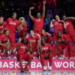 
              Gold medalists the United States celebrate on the podium after defeating China in the final at the women's Basketball World Cup in Sydney, Australia, Saturday, Oct. 1, 2022. (AP Photo/Mark Baker)
            