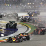 
              Red Bull driver Sergio Perez of Mexico leads the field soon after the start of the Singapore Formula One Grand Prix, at the Marina Bay City Circuit in Singapore, Sunday, Oct.2, 2022. (AP Photo/Danial Hakim)
            