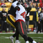 
              Pittsburgh Steelers quarterback Kenny Pickett, left, is hit by Tampa Bay Buccaneers linebacker Devin White (45) after releasing a pass during the second half of an NFL football game in Pittsburgh, Sunday, Oct. 16, 2022. Pickett was injured on the play and left the game. (AP Photo/Barry Reeger)
            