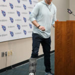 
              Tennessee Titans quarterback Ryan Tannehill wears a boot on his foot during a news conference following an NFL football game between the Tennessee Titans and the Indianapolis Colts Sunday, Oct. 23, 2022, in Nashville, Tenn. The Titans won 19-10. (AP Photo/Mark Humphrey)
            